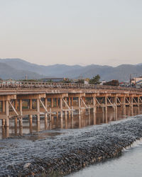 Bridge over river against clear sky