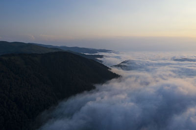 Scenic view of mountains against sky during sunset