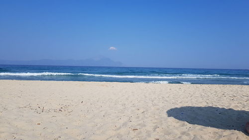 Scenic view of sea against clear blue sky