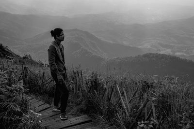 Full length of man standing on mountain