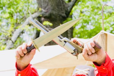 Man holding gun and knife