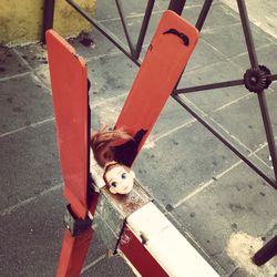 High angle view of doll head on metal