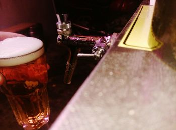 Close-up of beer glass on table