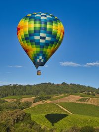 Hot air balloon flying over land