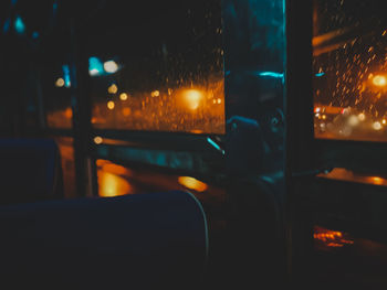 Illuminated street seen through car window