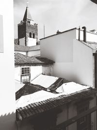 Low angle view of roof and building against sky