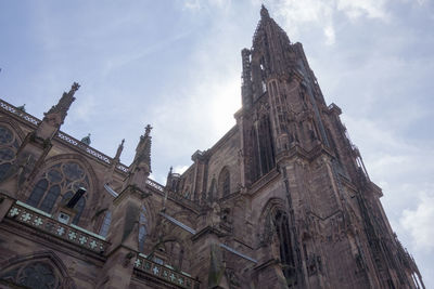 Low angle view of bell tower against sky