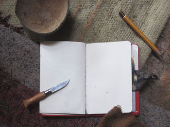 Directly above shot of blank book on table