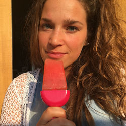 Portrait of smiling woman holding ice cream