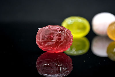 Close-up of candies against black background