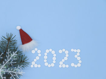 Directly above shot of christmas decorations on blue background