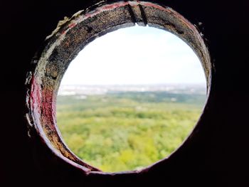 Close-up of landscape seen through window