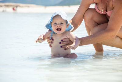 Mother and daughter in sea