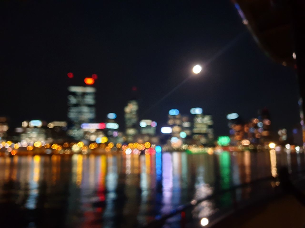 ILLUMINATED CITY STREET AT NIGHT