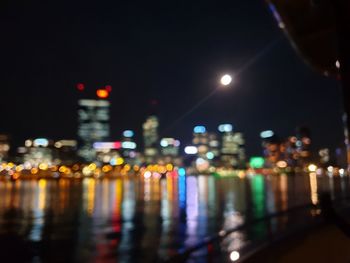 Defocused image of illuminated city at night