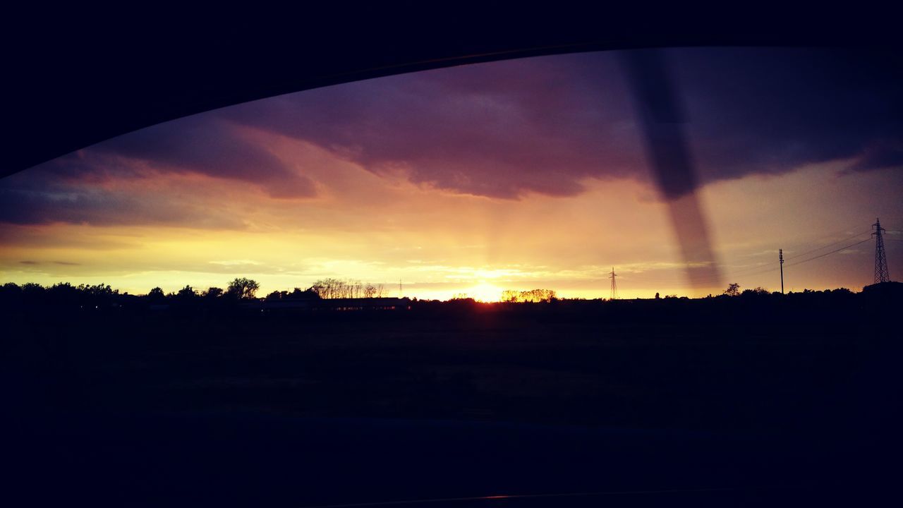 SILHOUETTE OF LANDSCAPE AT SUNSET