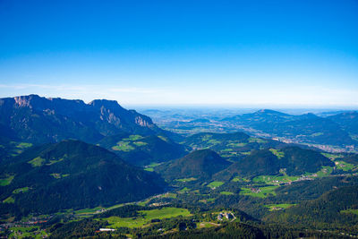 Scenic view of mountains against clear blue sky