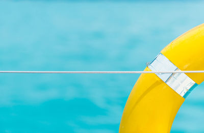 Cropped image of woman swimming in pool