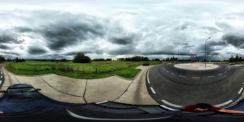 Scenic view of landscape against cloudy sky