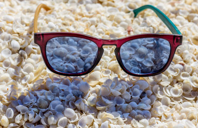 High angle view of sunglasses on glass