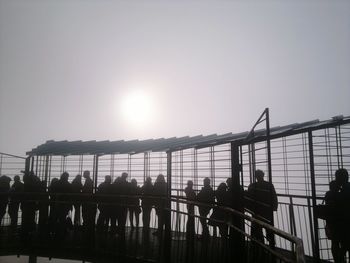 People in city against sky