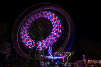 Low angle view of illuminated ferris wheel