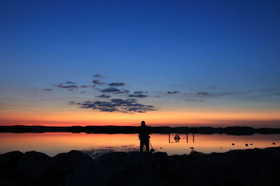 Silhouette of people at sunset