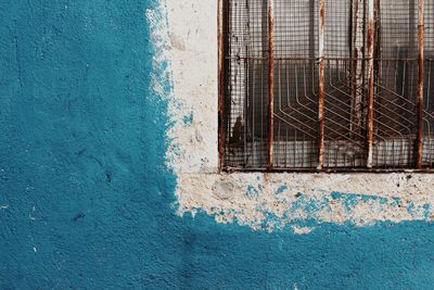 Broken window on wall of old building