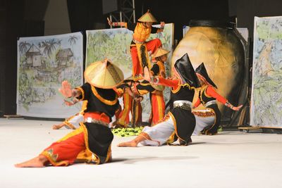 Group of people sitting on stage