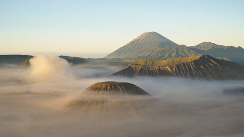 Aerial view of volcanic landscape against sky