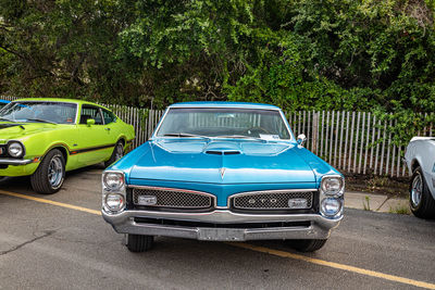 View of blue car on road