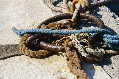 High angle view of ropes tied on hook