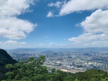 High angle view of buildings in city against sky