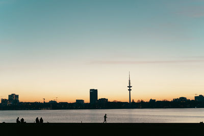 Scenic view of sea against clear sky during sunset