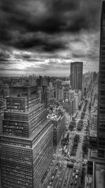 Cityscape against cloudy sky