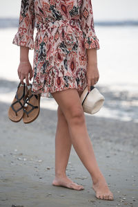 Low section of woman on beach