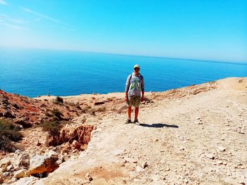 Man looking at sea against clear sky