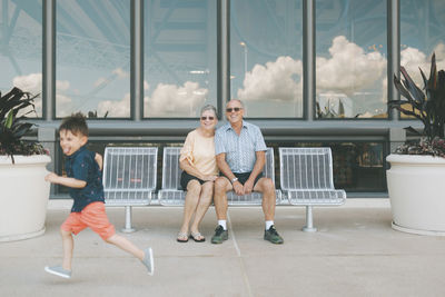 Grandparents watching running boy