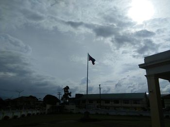 Low angle view of silhouette buildings against sky