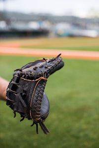 Close-up of baseball glove on field