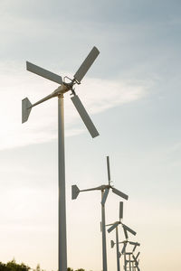 Low angle view of windmill against sky