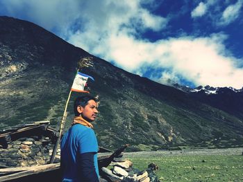 Man standing by mountain