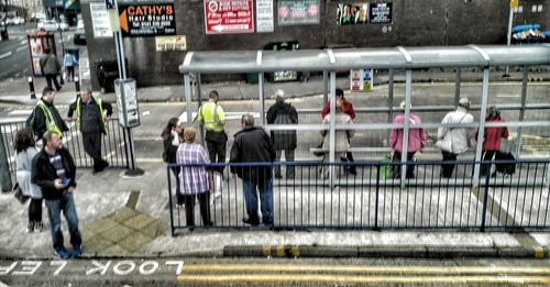 Blurred motion of people walking on road