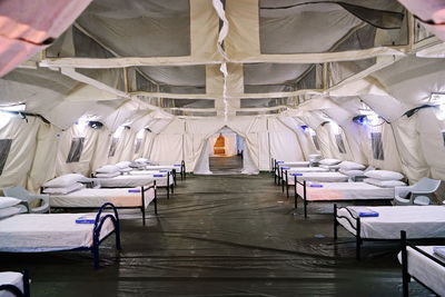 Temporary covid field hospital set up inside an exhibition pavilion