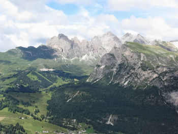 Scenic view of mountains against cloudy sky