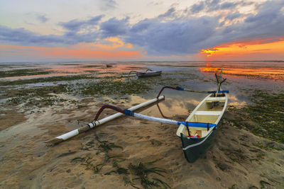 Scenic view of beach against sky during sunset