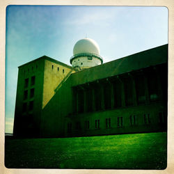 Low angle view of building against blue sky