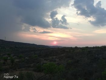 Scenic view of landscape against sky during sunset