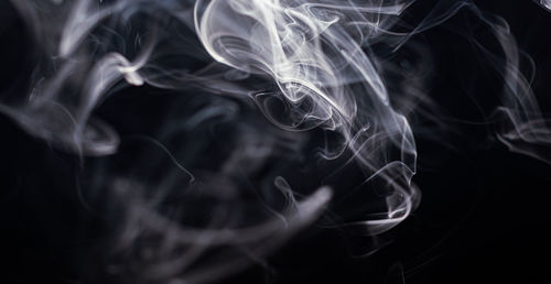 Close-up of smoke against black background