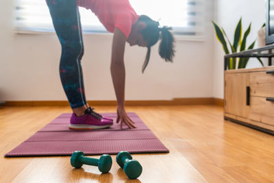 Low section of woman at home